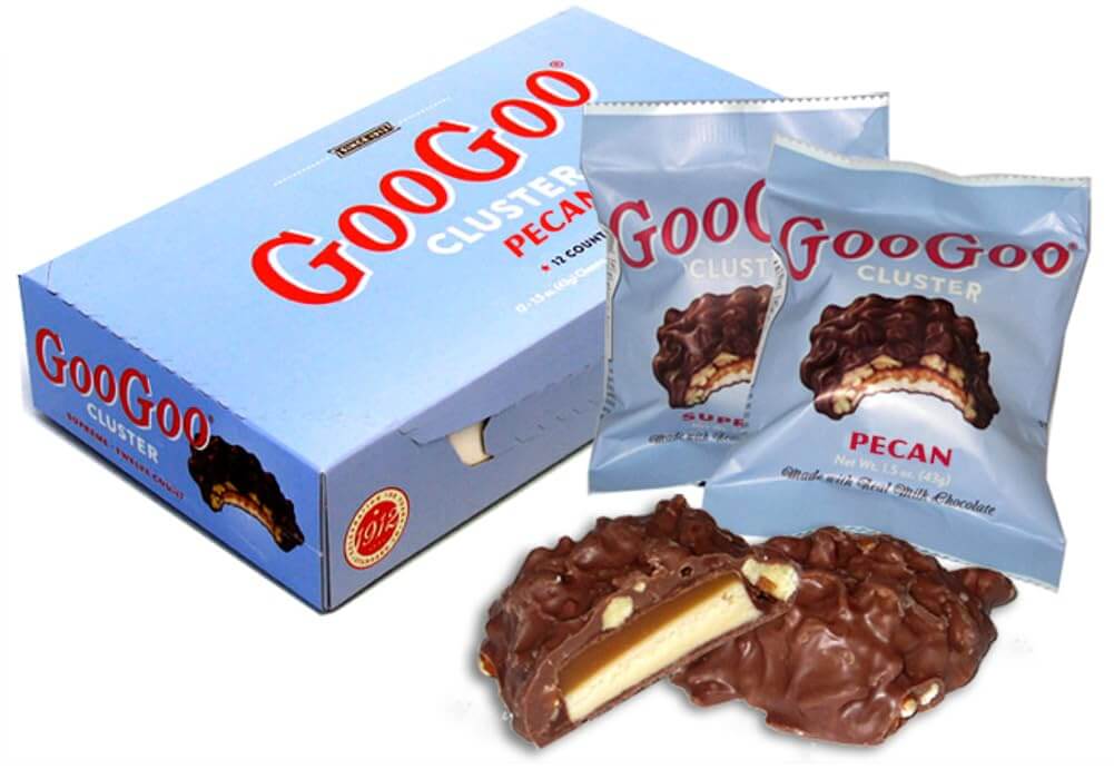 GooGoo Clusters Candy Bar box and pecan packs showcasing America's original candy since 1912.