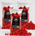 Hot Junior Snacks Co. Hot Cheddar bags filled with spicy cheddar popcorn on a gray background.